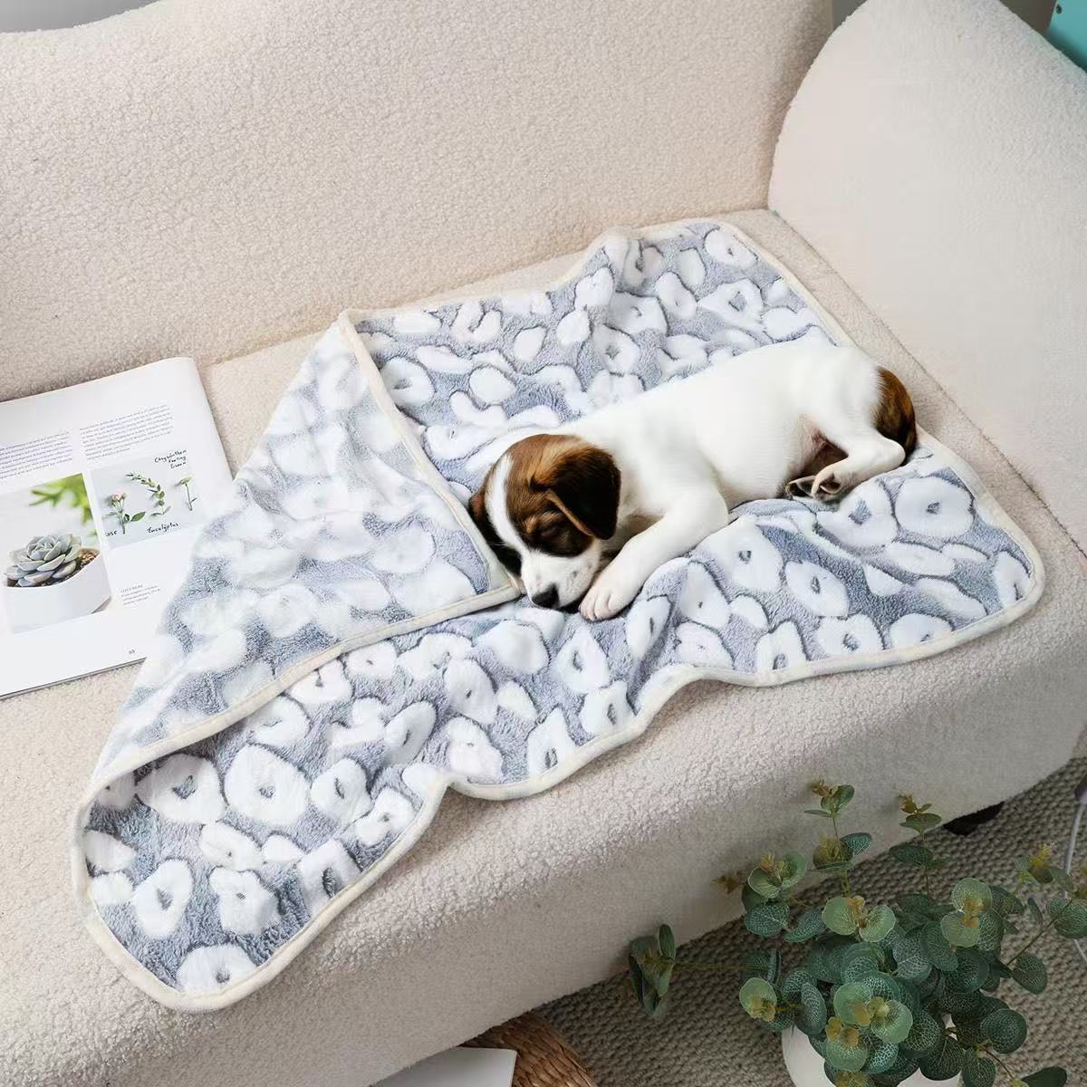 Puppy napping on a Blankora Snuggle Square gray spot print fleece pet mat
