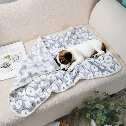 Puppy napping on a Blankora Snuggle Square gray spot print fleece pet mat
